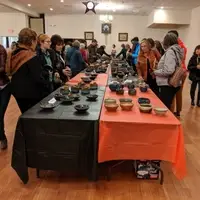 Ticket holders selecting artisan bowls during our Potter's Bowl event