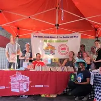 Volunteers tabling at a book giveaway
