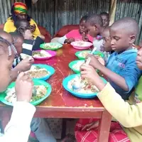 Children eating at smile community centre children's home
