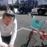 Sally helps fill out a tag for bike parking at an event