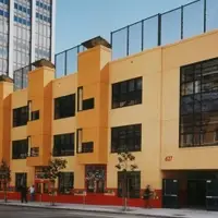 The brightest building in the Tenderloin is alive with children’s voices, laughter and energy as neighborhood students pour through the doors of the Tenderloin Community School.  This vibrant red and yellow elementary school opened in 1998 marking an important change in this low-income, inner-city community.   Now, thanks to BAWCC’s initiating and leading the effort to get this neighborhood school built, Tenderloin children have their own school, and families can be involved in their children’s education.