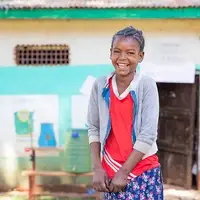 Luminos Second Chance student Absera outside her classroom in Ethiopia