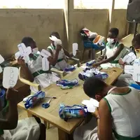 Girls participating in a hands-on training session on how to make reusable sanitary pads, acquiring knowledge on how to improve their menstrual hygiene, and staying in school.
