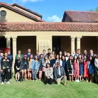 MIP Students, Faculty, and Staff gathering for a group photo at an end-of-year gathering
