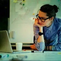 Woman looking at laptop