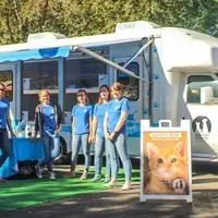 team at adoption event with mobile adoption center