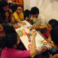 A group of people gather together to take an art break