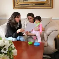 Graduate student working with family