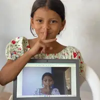 Child with laptop at Honduras Child Alliance
