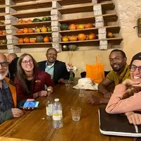 Delegates of Worldwide Opportunities on Organic Farms, in France sitting together for a friendly talk after the WWOOF International meeting, held in France in September 2025.