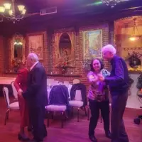 Eva and Adam Rajczyk, Demet Haksever, and Bill Lang dancing