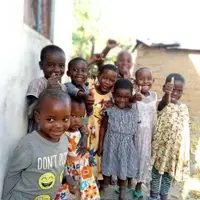 Children in Tanzania smiling and playing together during an educational program organized by Bring Hope for Children Tanzania, which promotes child rights, education, and healthcare in a safe and supportive environment.