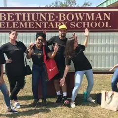 Teachers posing outside.