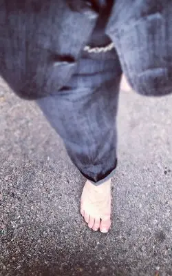 Someone walking with bare feet.