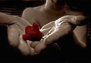 A person holding a rose.