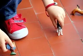 a boy playing with toys