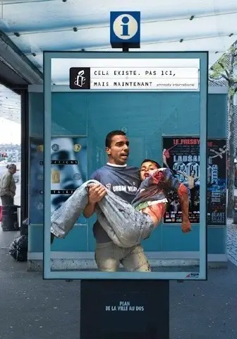 A man holding an injured child.