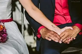 Woman holding a man's hand