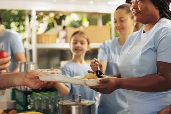 volunteers serving food
