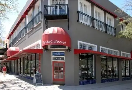 Volunteer surrounded by Beautiful Art!