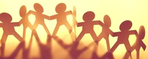 A chain of paper dolls.