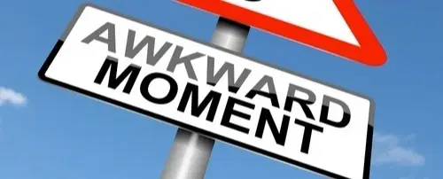A sign that says 'Awkward Moment'.