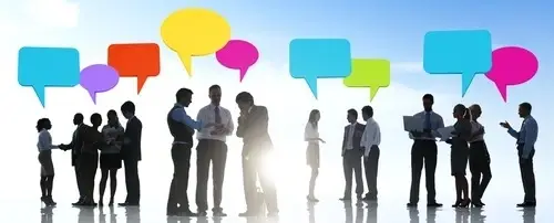 People at work with colorful speech bubbles above their heads.