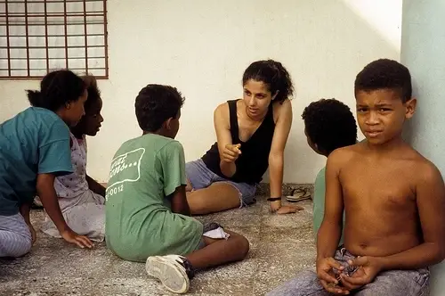 Group of children with volunteer