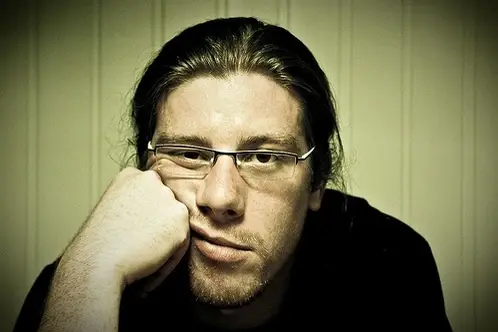 Man leaning on his fist.
