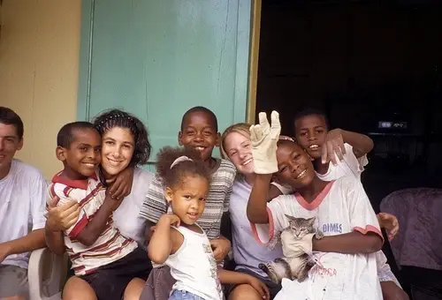 Woman and children smiling and laughing.
