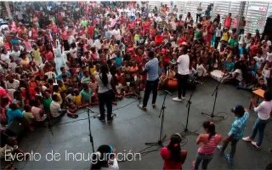A group of people talking to a crowd.