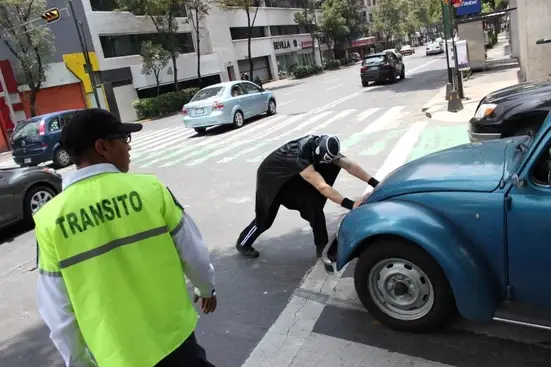 Man pushing a car