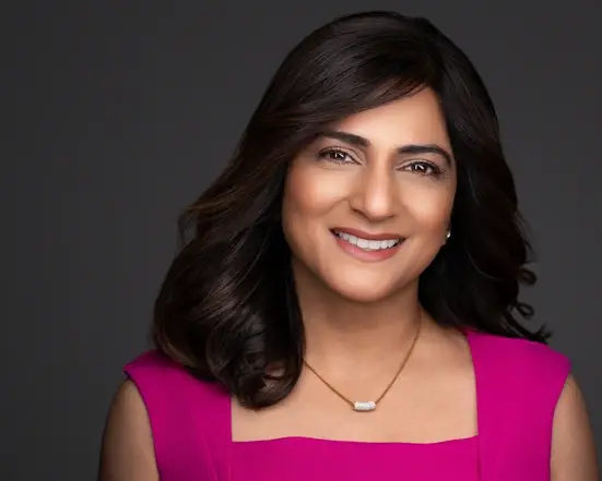 A woman in a pink shirt