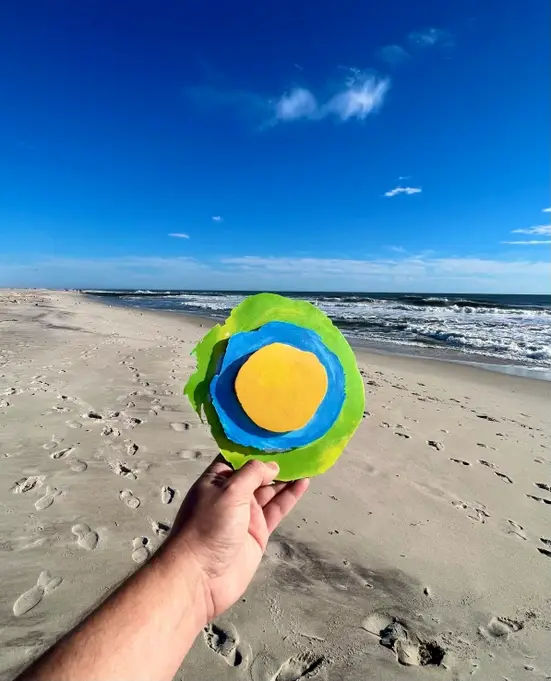 Logo on beach.
