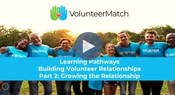 group of volunteers with arms around each other banner growing the relationship