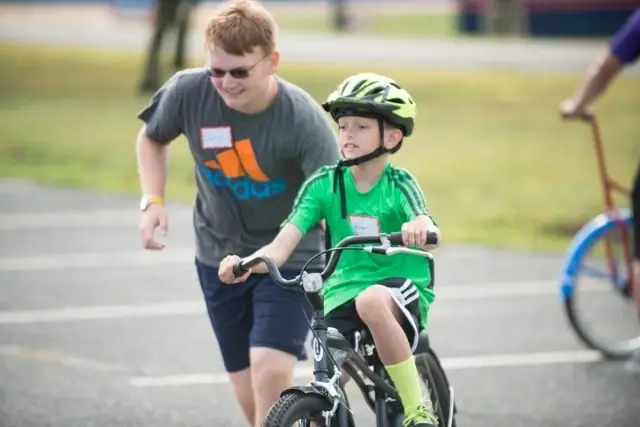 Help a child with a disability learn to ride a bike!