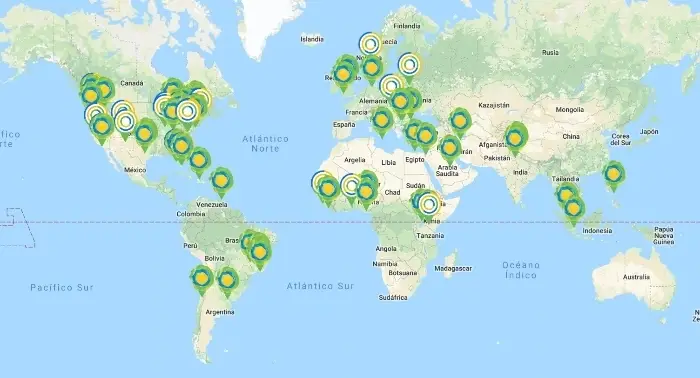 A map of the world with certain places highlighted with the idealist logo.