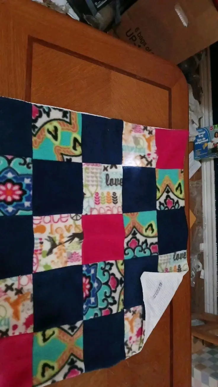Crazy quilt style quilt sewists using our scraps, and returning everything to March of the Blanketeers