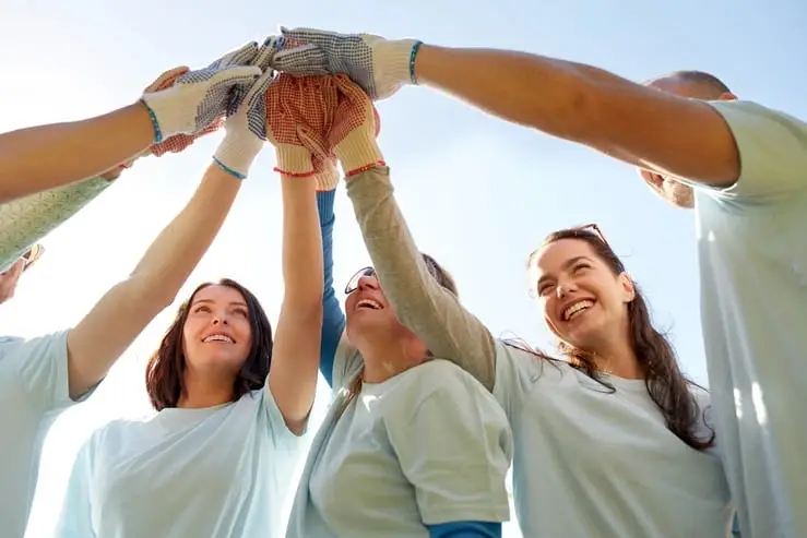 A group of volunteers celebrate a job well done