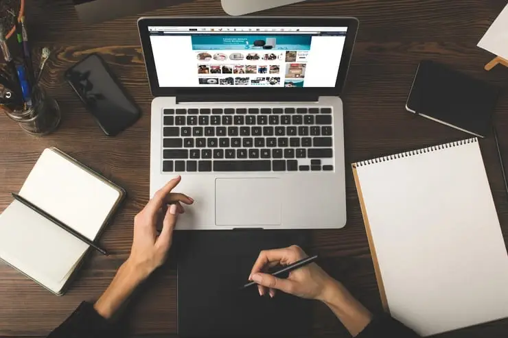 Photo of a person sitting at a computer