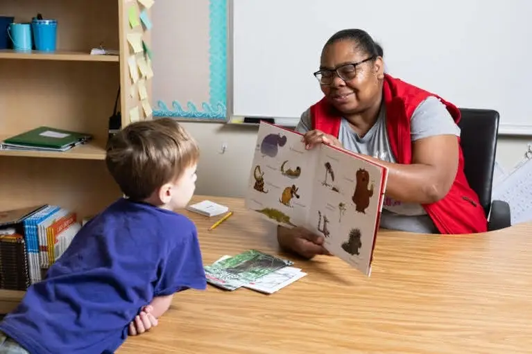 Tutoring students at Hollydale Elementary School