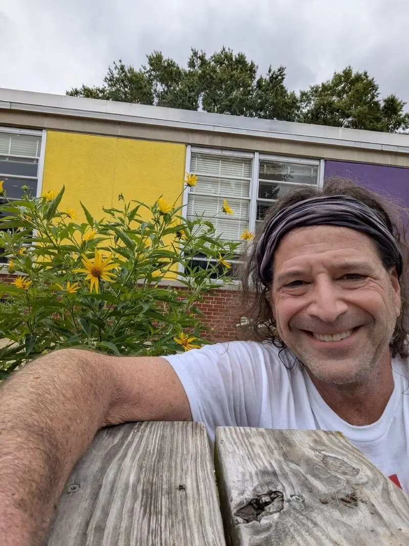 Alex participates in a clean-up activity in Virginia.