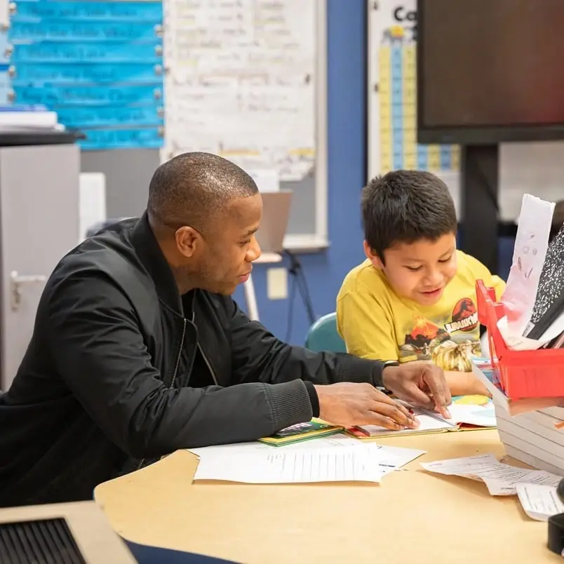 Read with a student at Wheatley Elementary