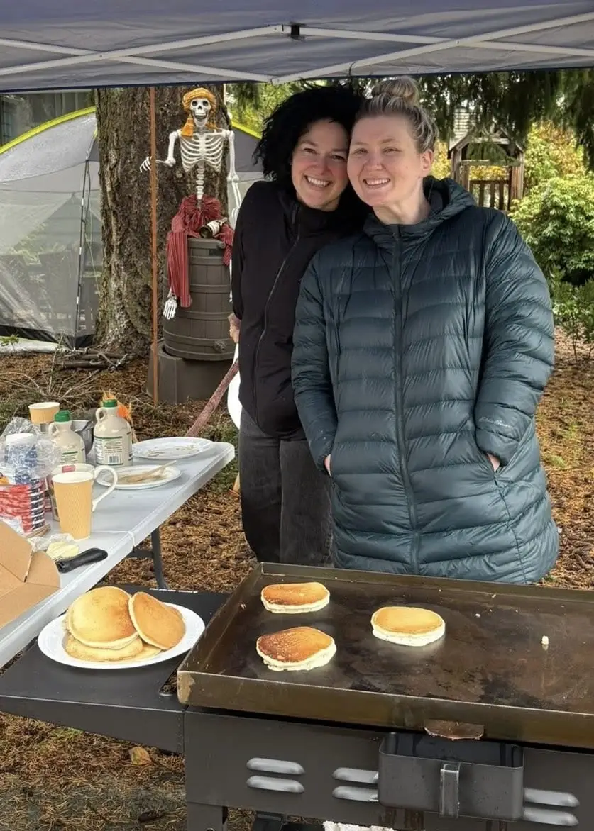 Shauna and Brittany smile at one of the many pancake pop-ups they've hosted over the last year.