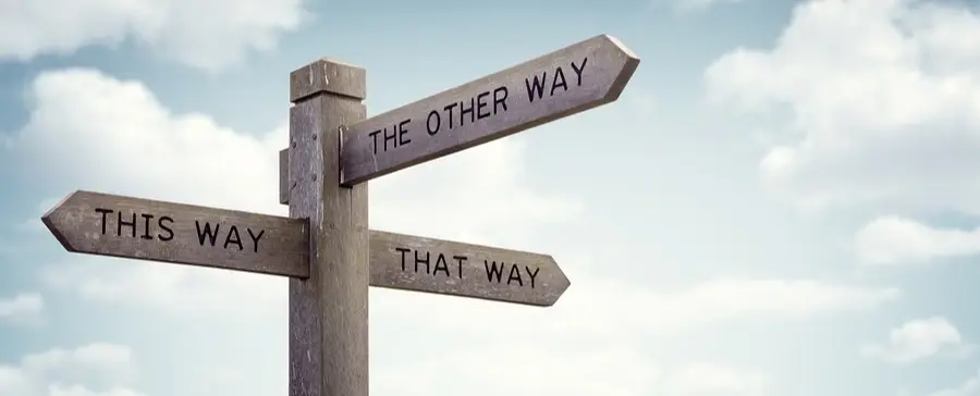 A street sign, with arrows pointing in different directions.