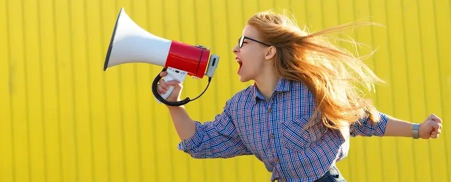 Someone yelling into a megaphone.