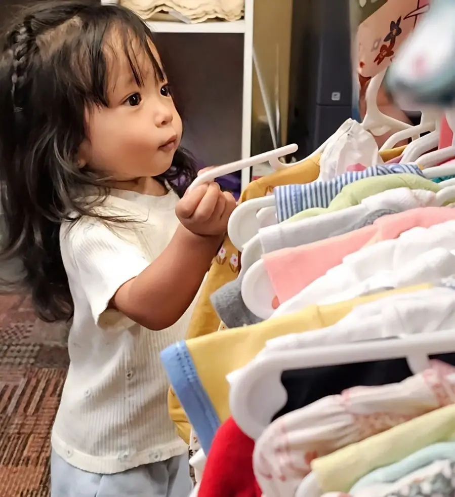 Sort clothing donations for the kids