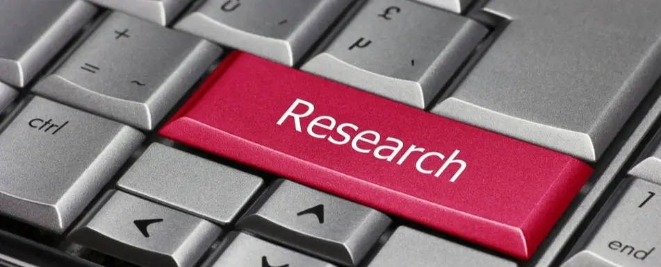 A keyboard with a red key that says 'Research'.