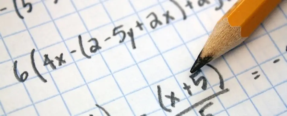 Close up of a piece of paper with a pencil on it.