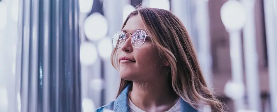 woman looking thoughtfully to the side